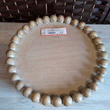 TAN, ROUND WOODEN TRAY