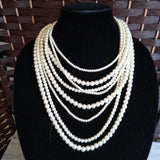 PEARLS NECKLACE,IVORY,8 STRAND,DIFERENT SIZES